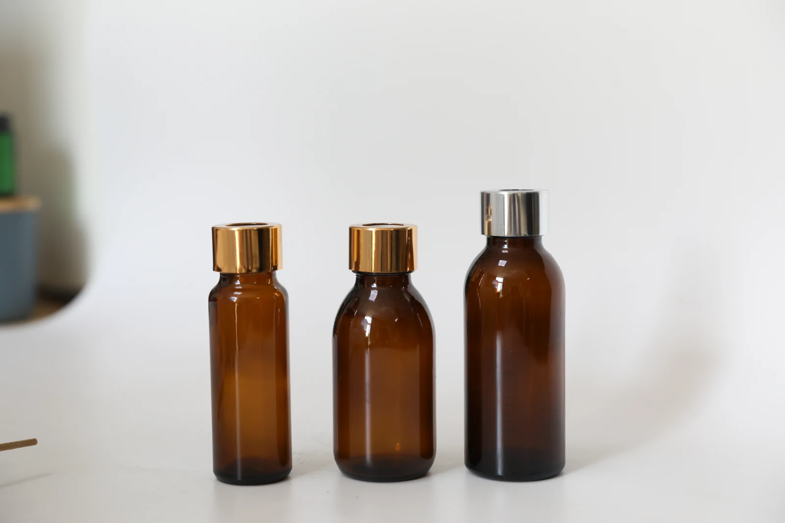 Amber slender reed diffuser bottles with metallic collars