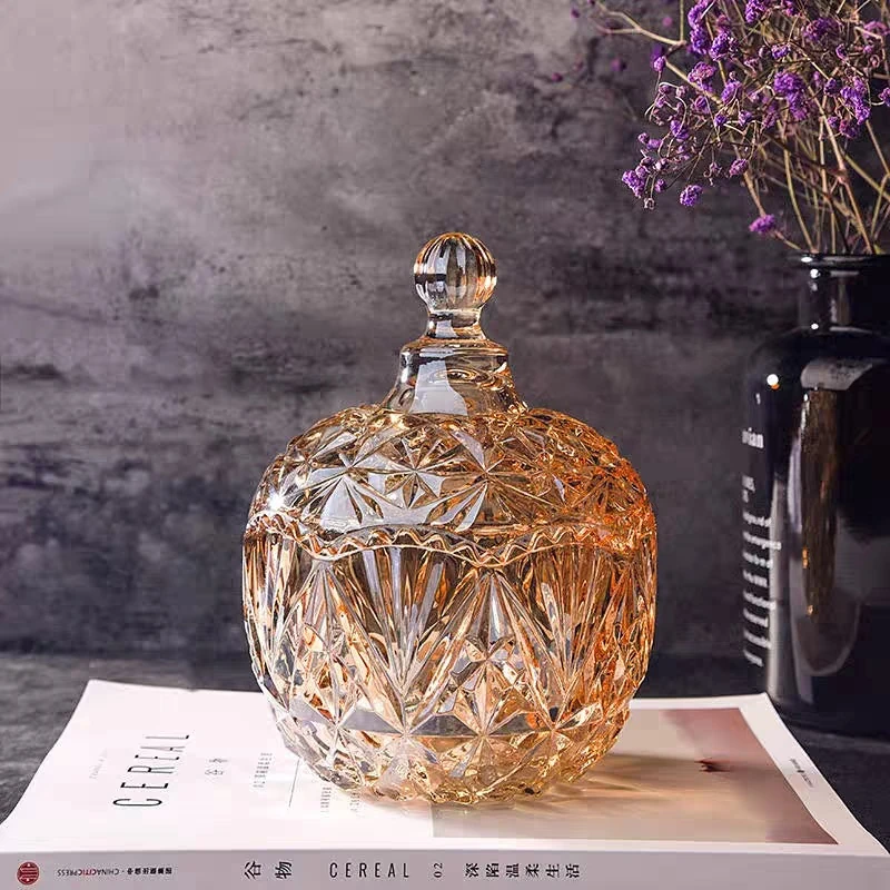 Faceted champagne-tone lidded glass jar shown as a candle vessel style reference