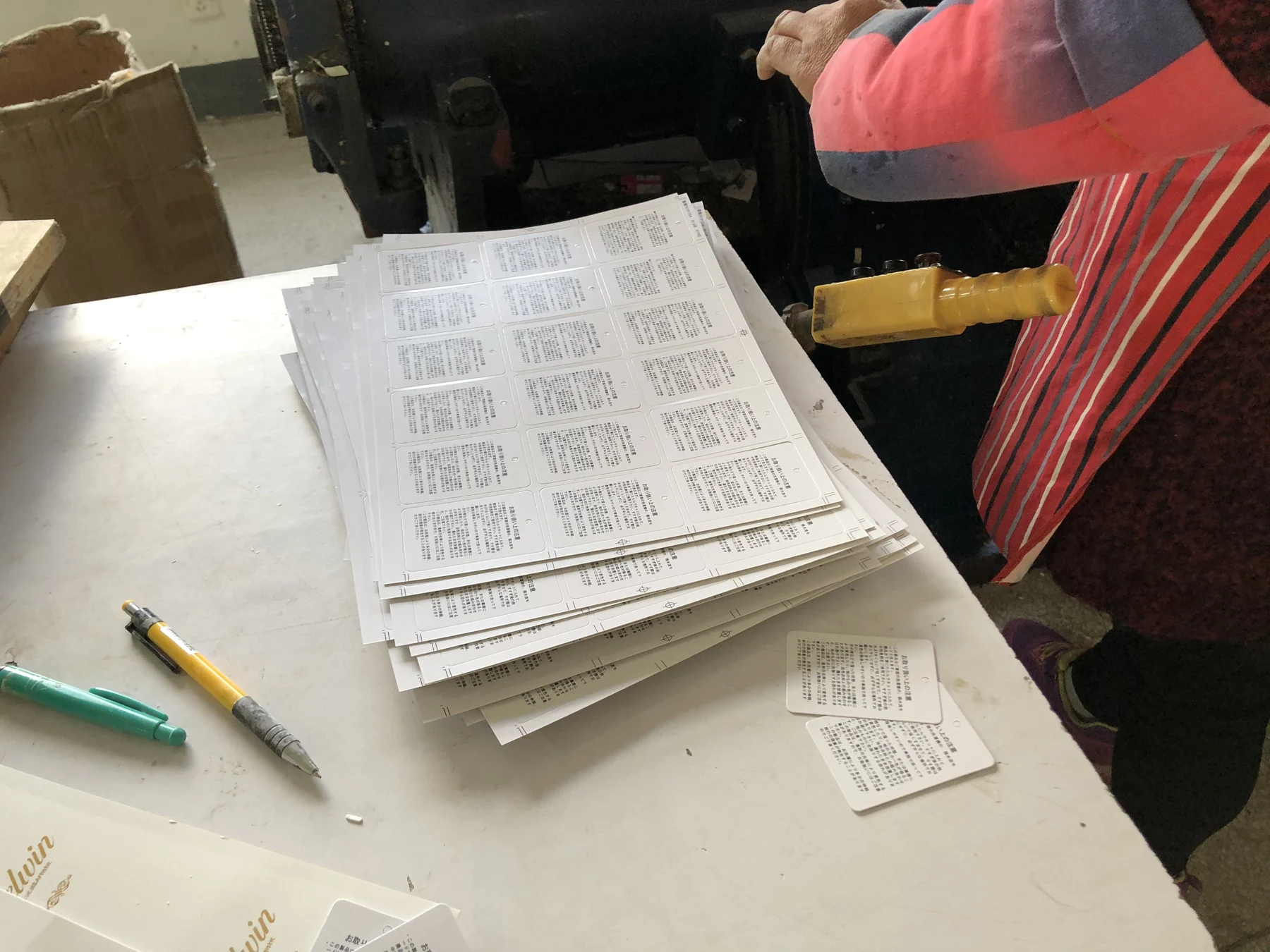 Printed label sheets at a packaging and print workstation